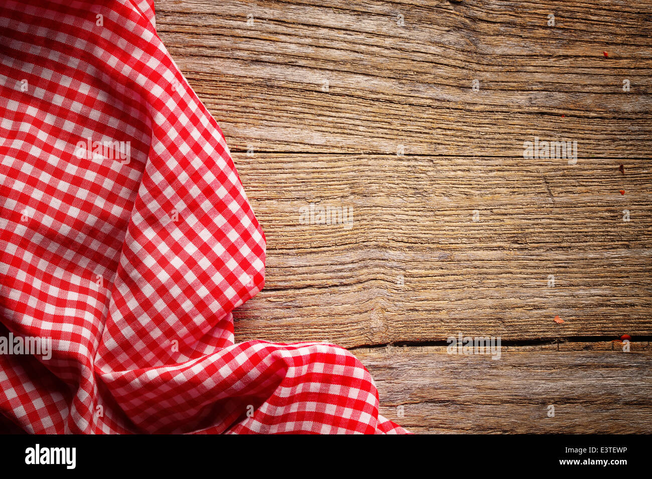 Checkered tablecloth on wooden table Stock Photo