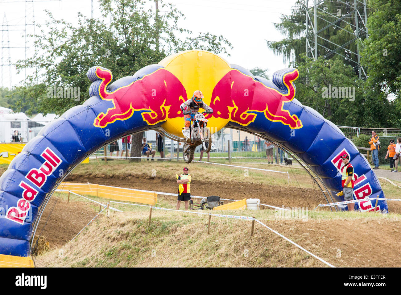 Aichwald, Germany. 27th June, 2014. Motocross ADAC MX Masters 2014 with ' RED BULL' sponsor. Motocross rider are  jumping through the 'Red Bull' arch Credit:  mezzotint alamy/Alamy Live News Stock Photo