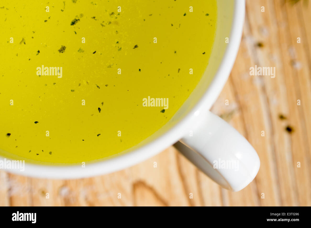 Broth, bouillon, clear soup in a white cup Stock Photo