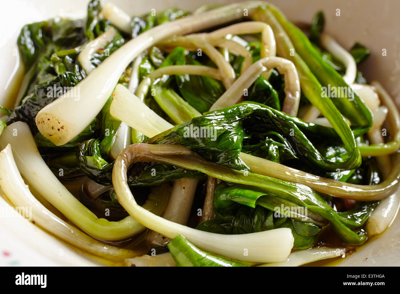 bowl of fried ramps Stock Photo Alamy