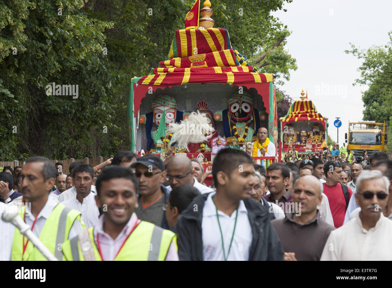 London, UK. 29th June, 2014. Two chariots were pulled through the streets of Queensbury Park to the Shree Swaminarayan Temple in Stanmore, North London, by hundreds of devotees. Rath Yatra is a celebration where Lord Jagannath is seated in a divine chariot (Rath) and taken through the city of Jagannath Puri. Credit:  Lee Thomas/ZUMA Wire/ZUMAPRESS.com/Alamy Live News Stock Photo