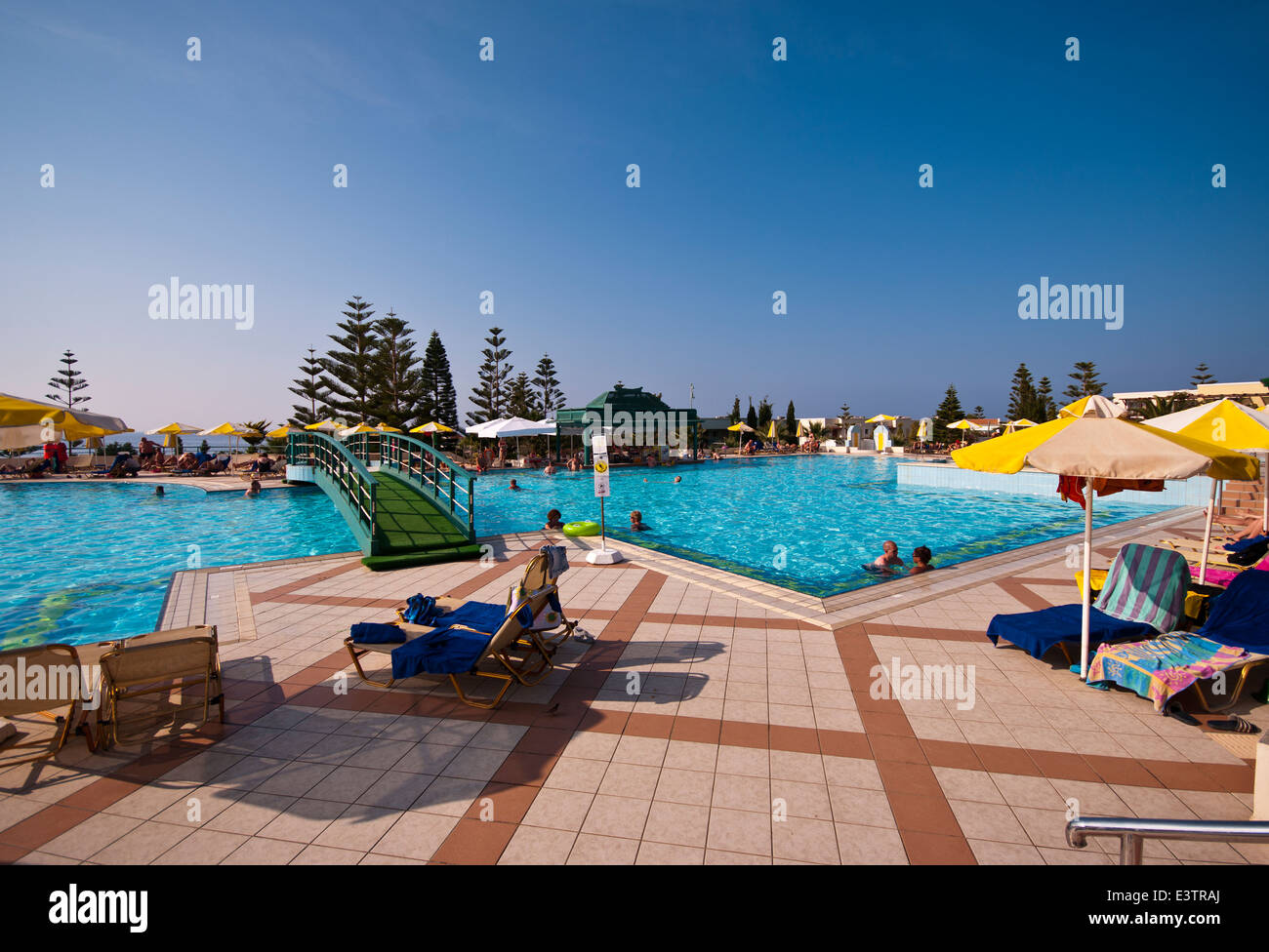 People On Holiday Enjoying The Sun In and Around The Hotel Swimming Pool Iberostar Creta Marine Panormo Crete Stock Photo