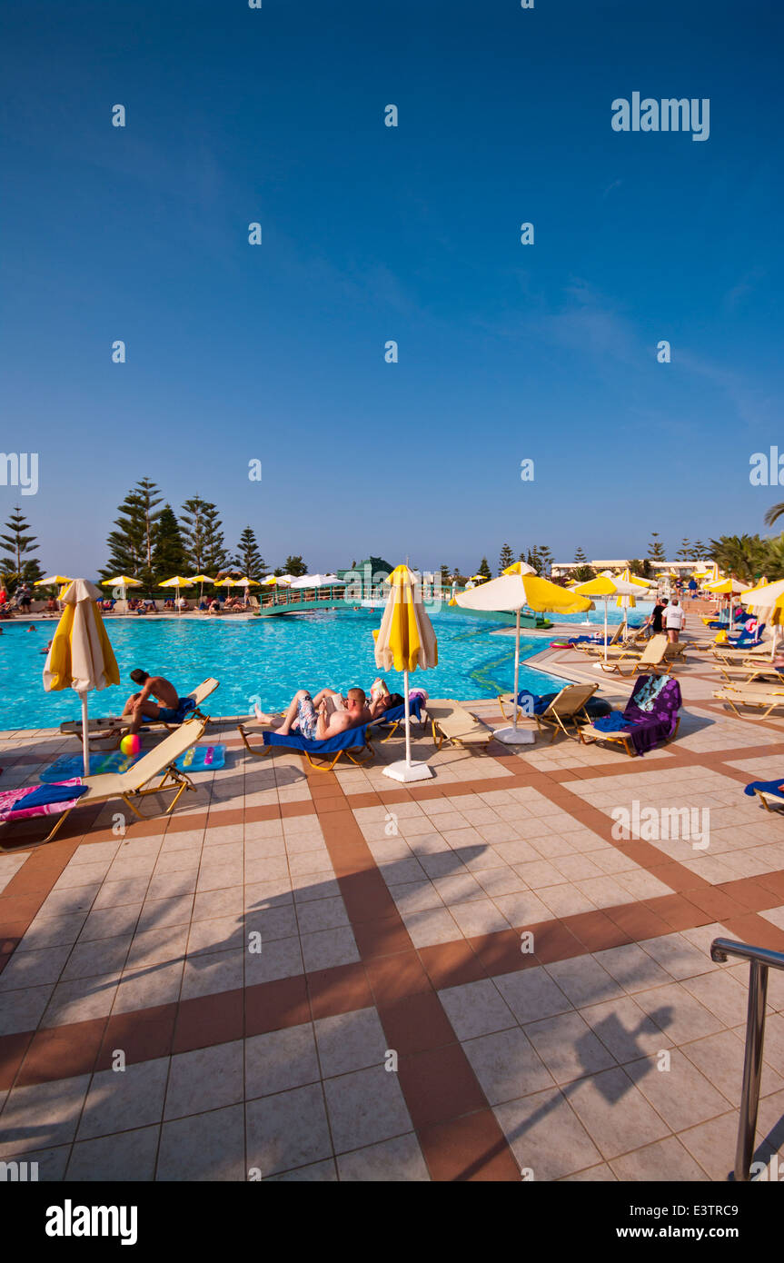 People On Holiday Enjoying The Sun In and Around The Hotel Swimming Pool Iberostar Creta Marine Panormo Crete Stock Photo