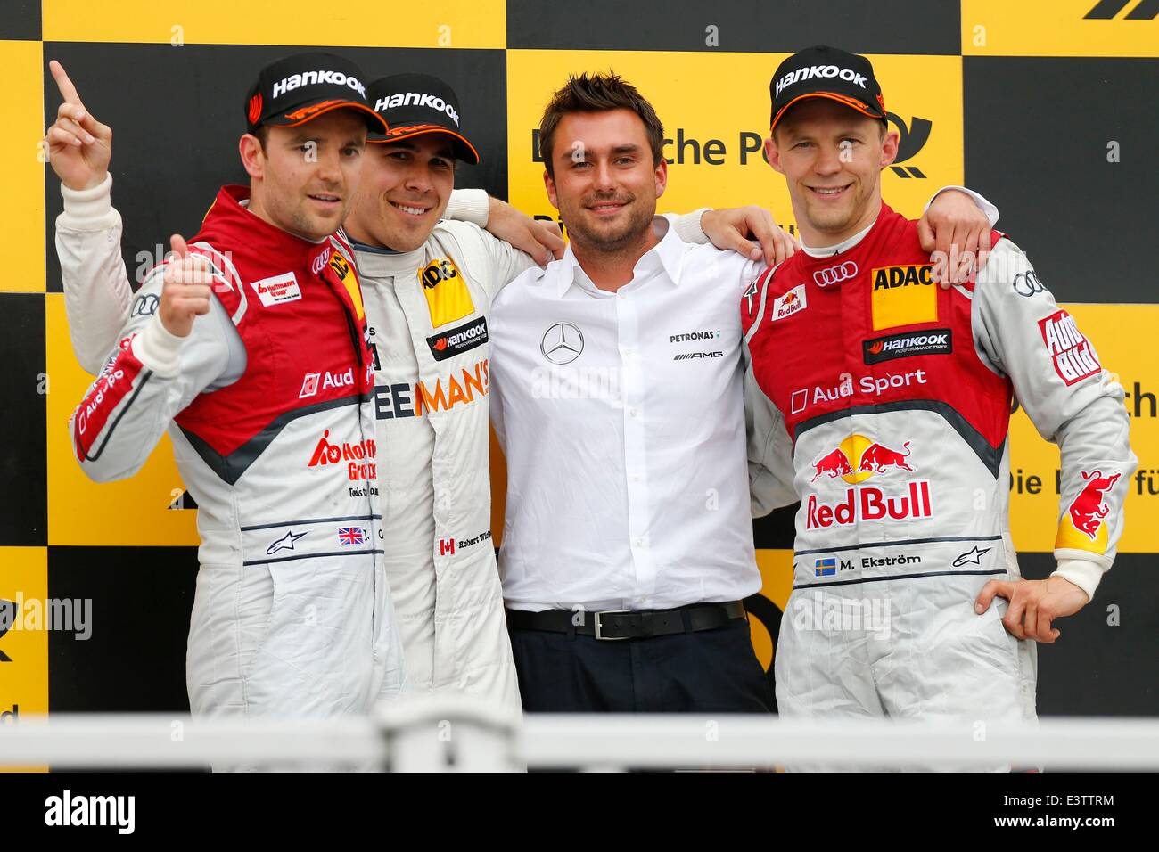 Nuremberg, Germany. 29th June, 2014. HANDOUT - A handout picture provided by Juergen Tap/ITR/dpa shows British pilot Jamie Green (Audi Sport Team Rosberg, L-R), Canadian pilot Robert Wickens (Free Man's World Mercedes AMG), Dennis Naegele (Wickens 'car chief) and Swedish pilot Mattias Ekstroem (Audi Sport Team Abt) after the DTM, German Touring Car Masters race at Norisring in Nuremberg, Germany, 29 June 2014. Wickens won against Green and Eckstroem. Credit:  dpa/Alamy Live News Stock Photo