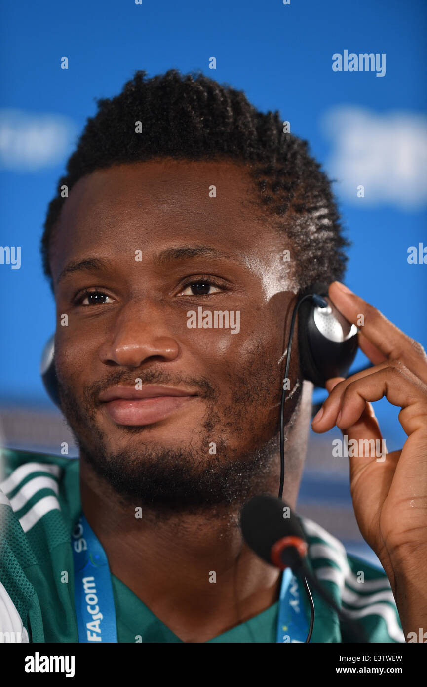 Brasilia, Brazil. 29th June, 2014. Nigeria's national soccer team player John Obi Mikel listens during a press conference at the 'Mane Garrincha' National Stadium in Brasilia, Brazil, 29 June 2014. Nigeria will face France in the FIFA World Cup 2014 round of 16 match in Brasilia on 30 June 2014. Credit:  dpa picture alliance/Alamy Live News Stock Photo