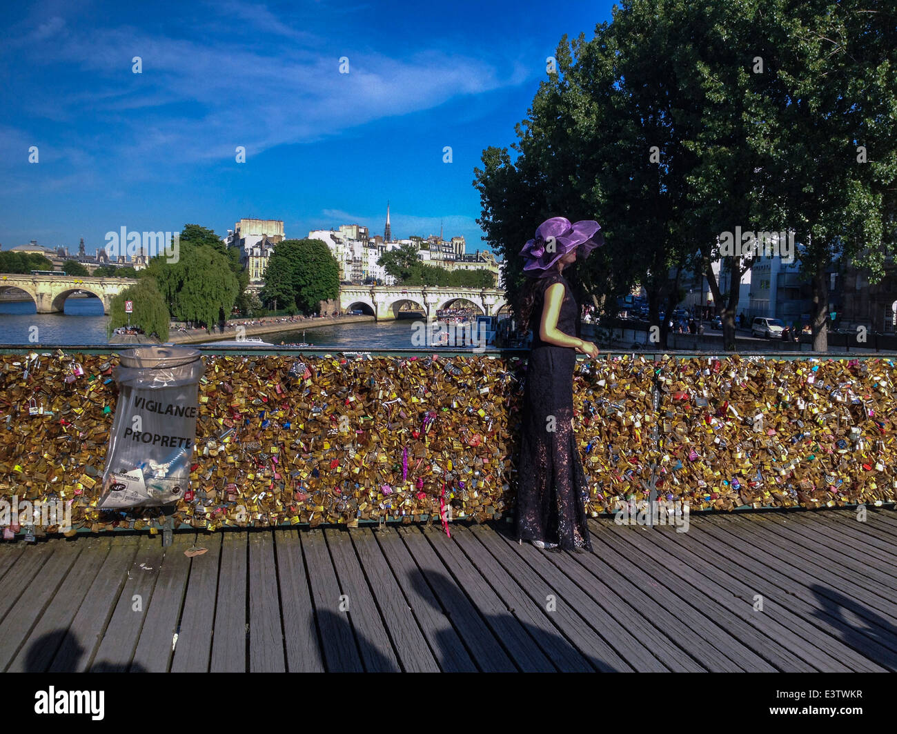 Paris, France, Tourist Taking photos, Female Model, on Seine River Bridge, Pont des Arts with Love Locks Stock Photo