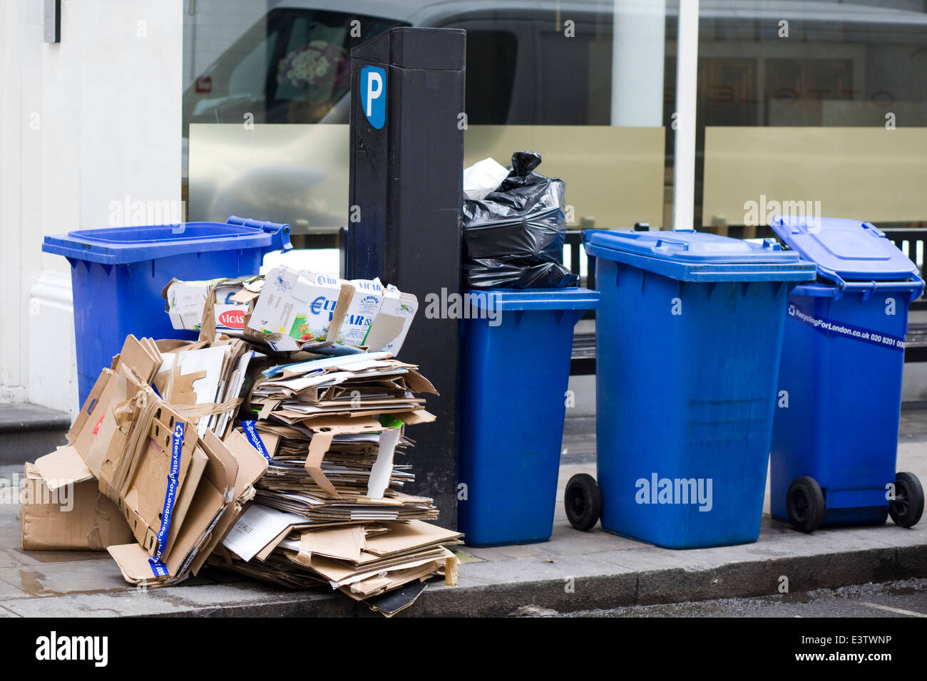 Cardboard boxes on street for recycling hires stock photography and