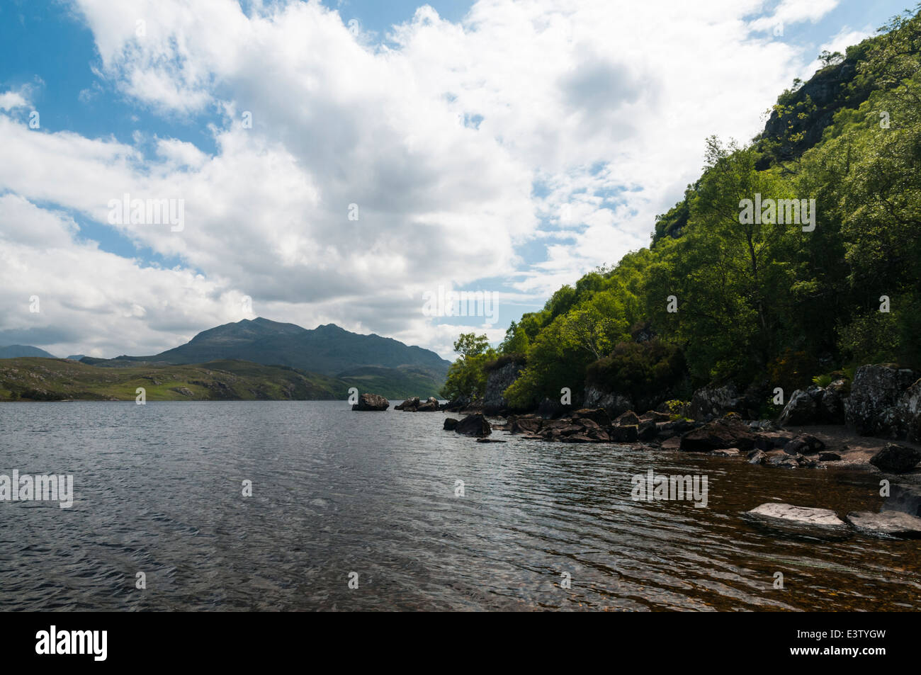 A summer view of western end of Loch Maree from Tollie Bay with Beinn  Airigh Charr in the distance, Wester-Ross, Scotland. 30 May 2014 Stock Photo