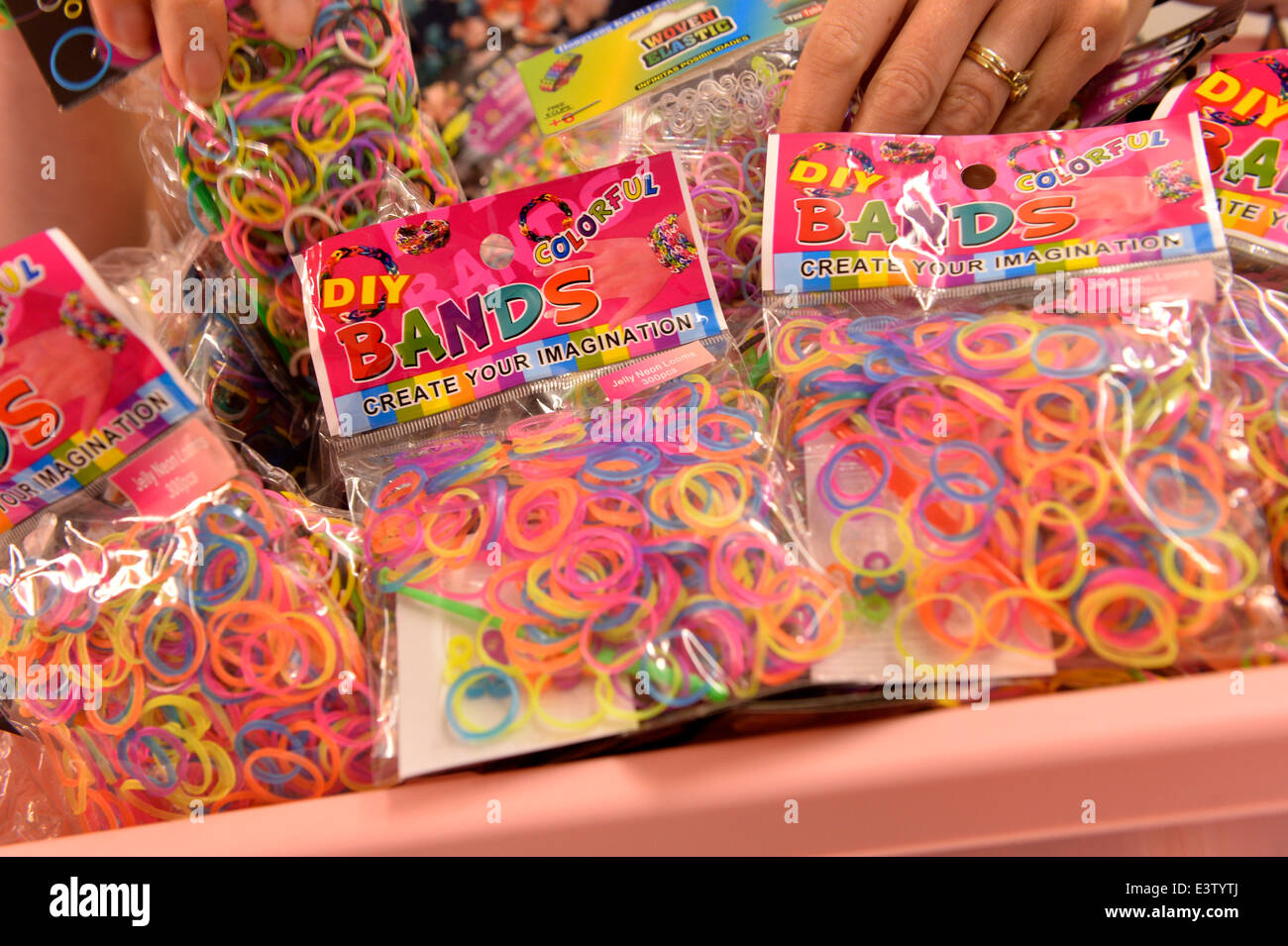 Loom bands the multi coloured elastic rubber bands that are the latest craze for children. The bright bands are woven together to create jewellery STUART WALKER / ALAMY NEWS Stock Photo