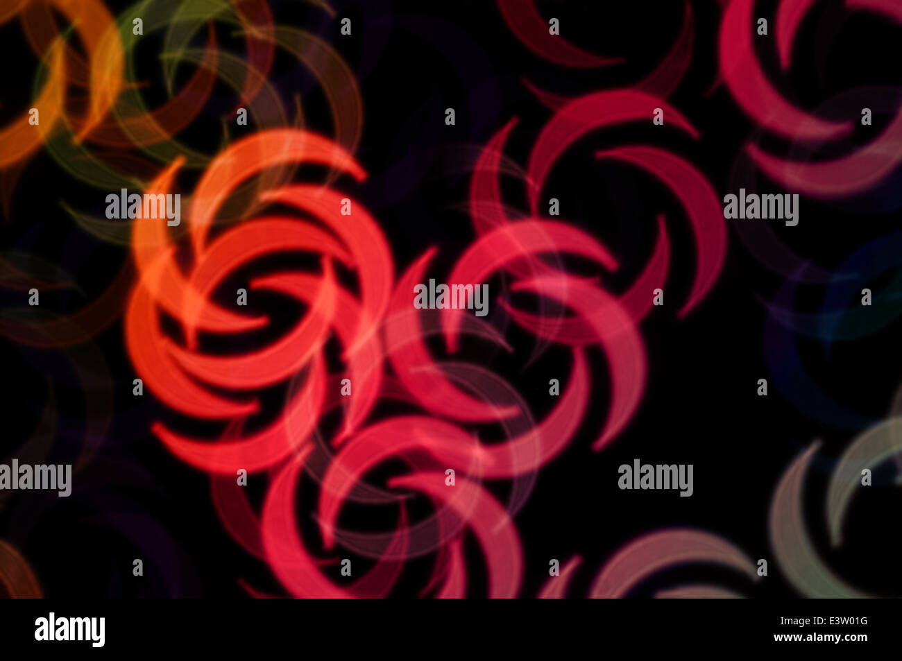 Abstract swirl shapes colorful orbs blur party background. Stock Photo