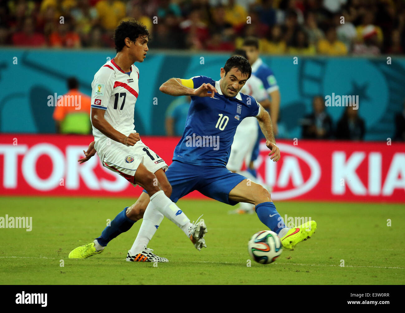 Recife, Brazil. 29th June, 2014. World Cup 2nd Round. Costa Rica versus Greece. Tejeda challenged by Karagounis Credit:  Action Plus Sports/Alamy Live News Stock Photo