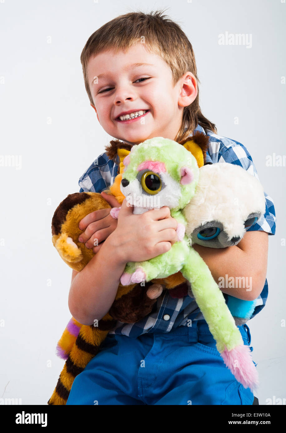Young boy playing with his toys Stock Photo - Alamy