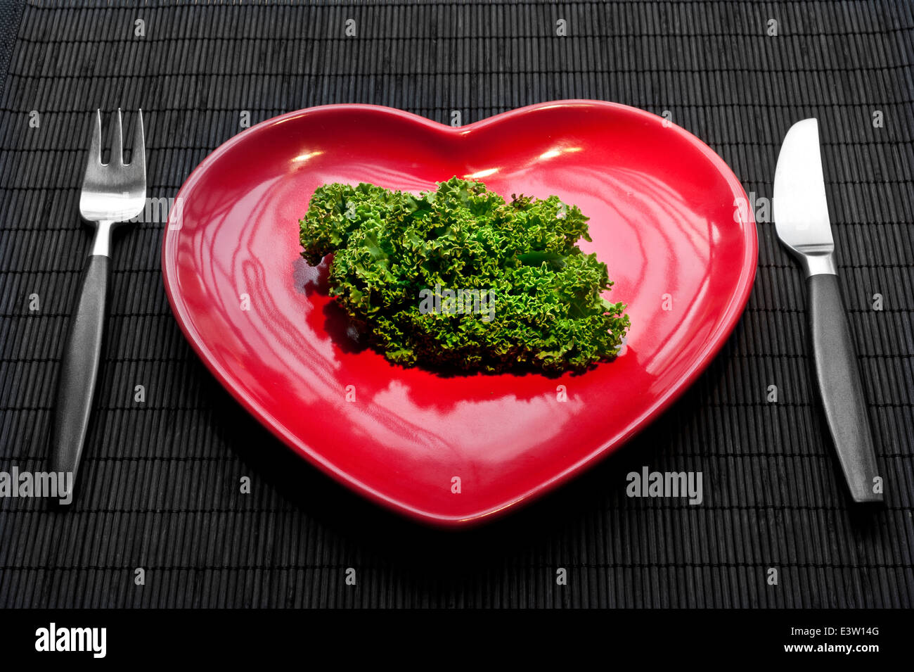 KALE Concept healthy eating regime with heart shaped plate and Kale