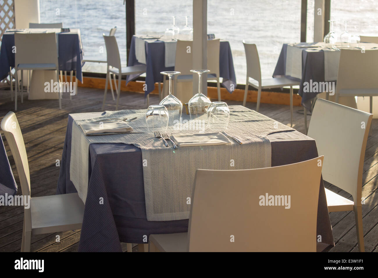 'set table'cafe restaurant day sea [beach cafe] [sea restaurant] 'through window' Stock Photo