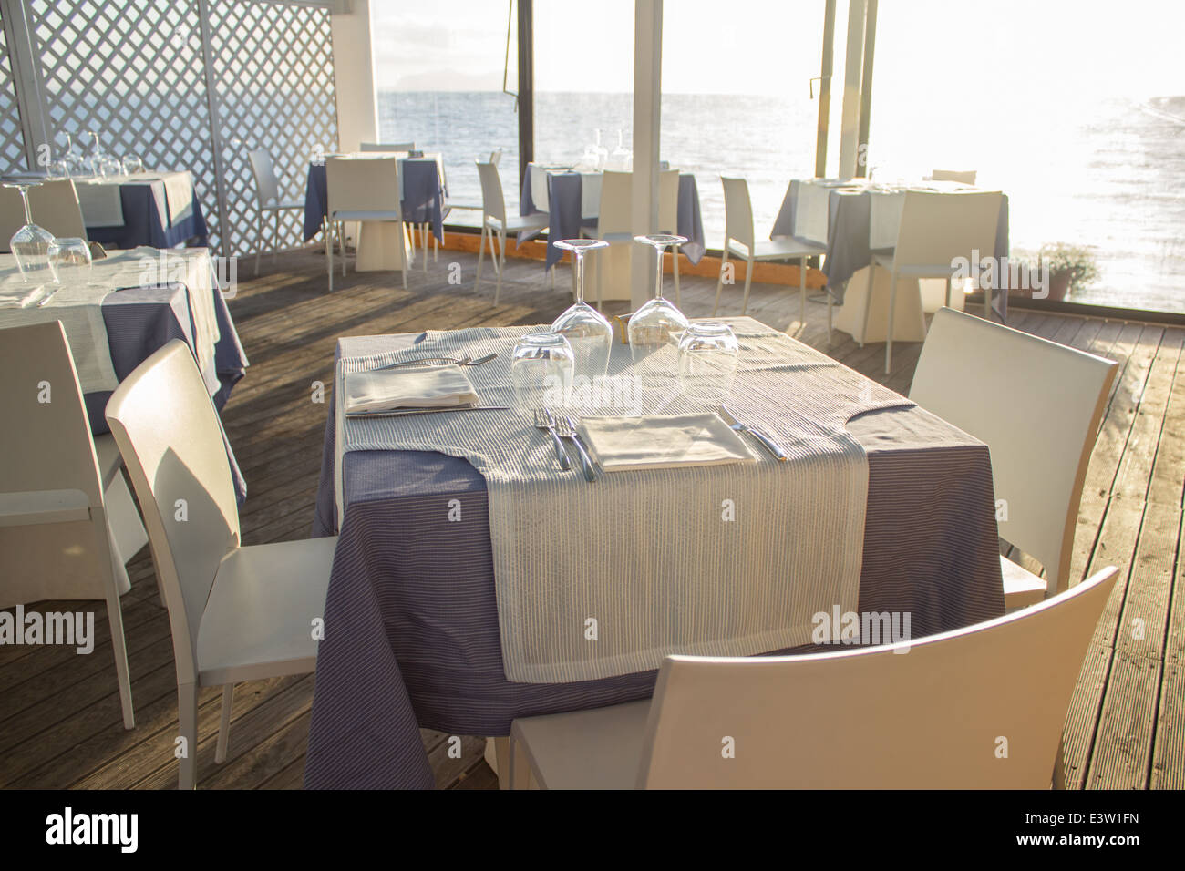 'set table'cafe restaurant day sea horizon [beach cafe] [sea restaurant] 'through window' Stock Photo