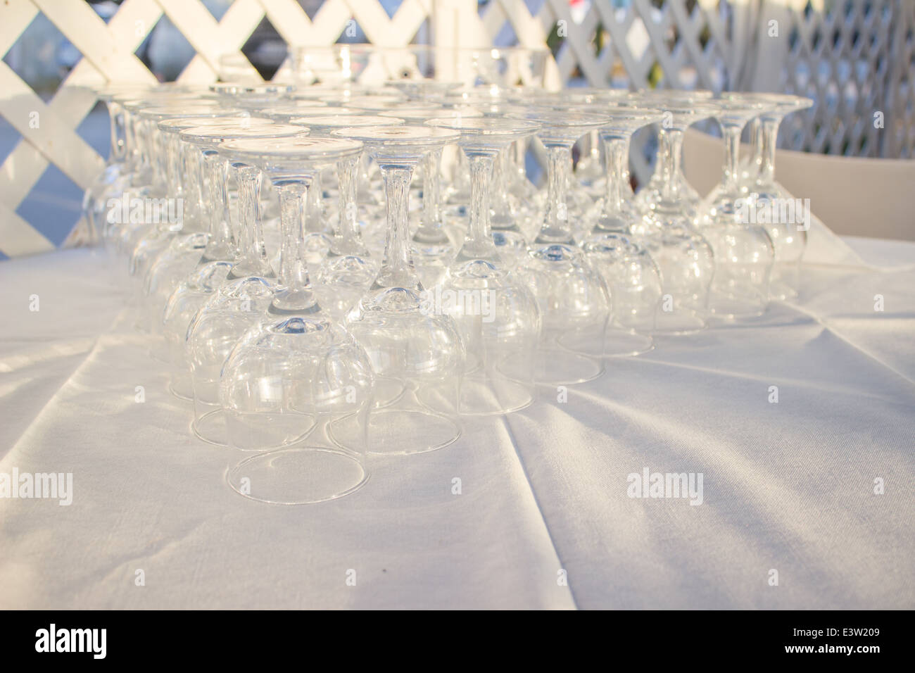 'vine glasses' glass glasses many row restaurant white cloth material cafe Stock Photo