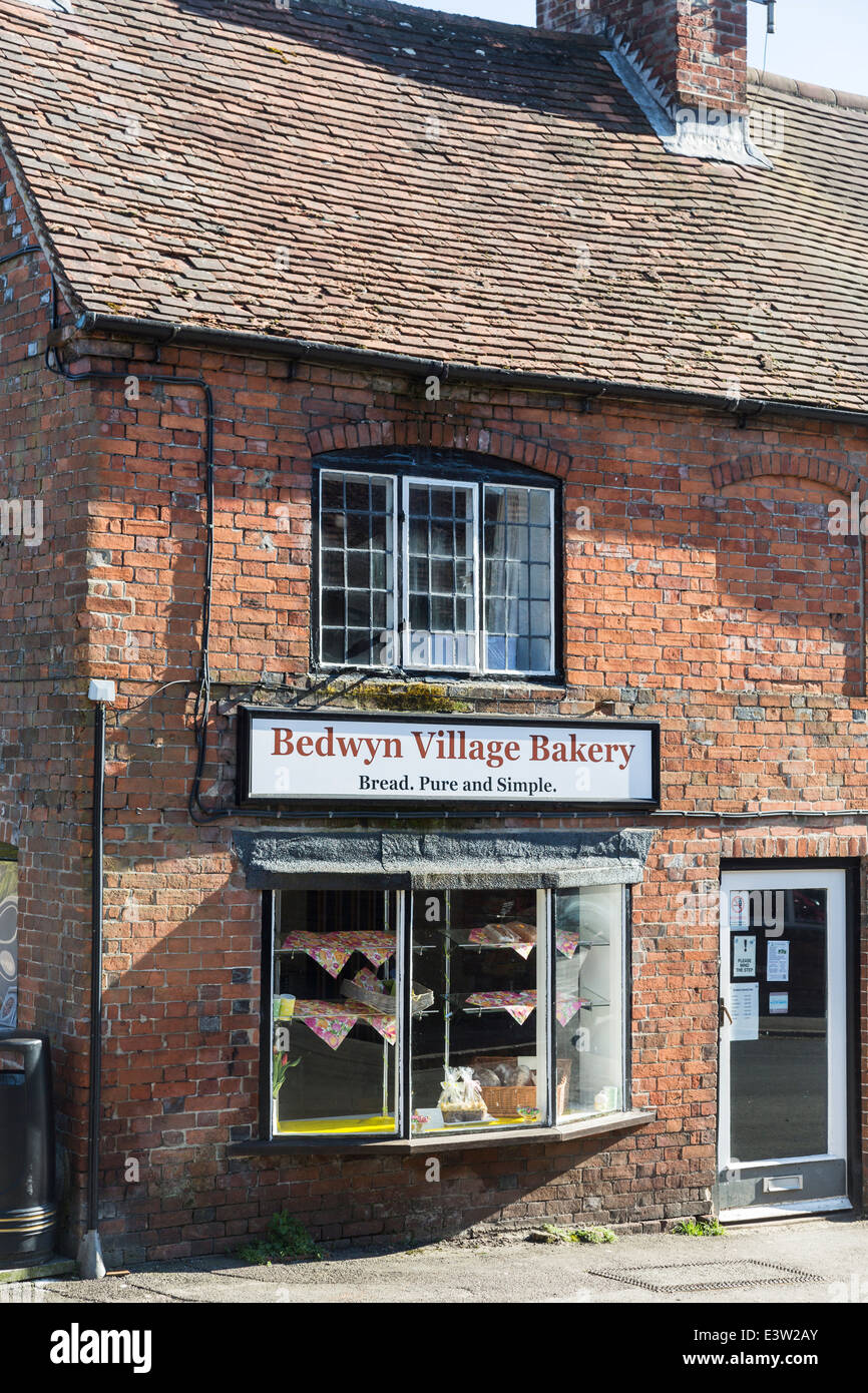 Traditional baker's shop in an old row of brick terraced buildings in the Wiltshire village of Great Bedwyn, UK Stock Photo