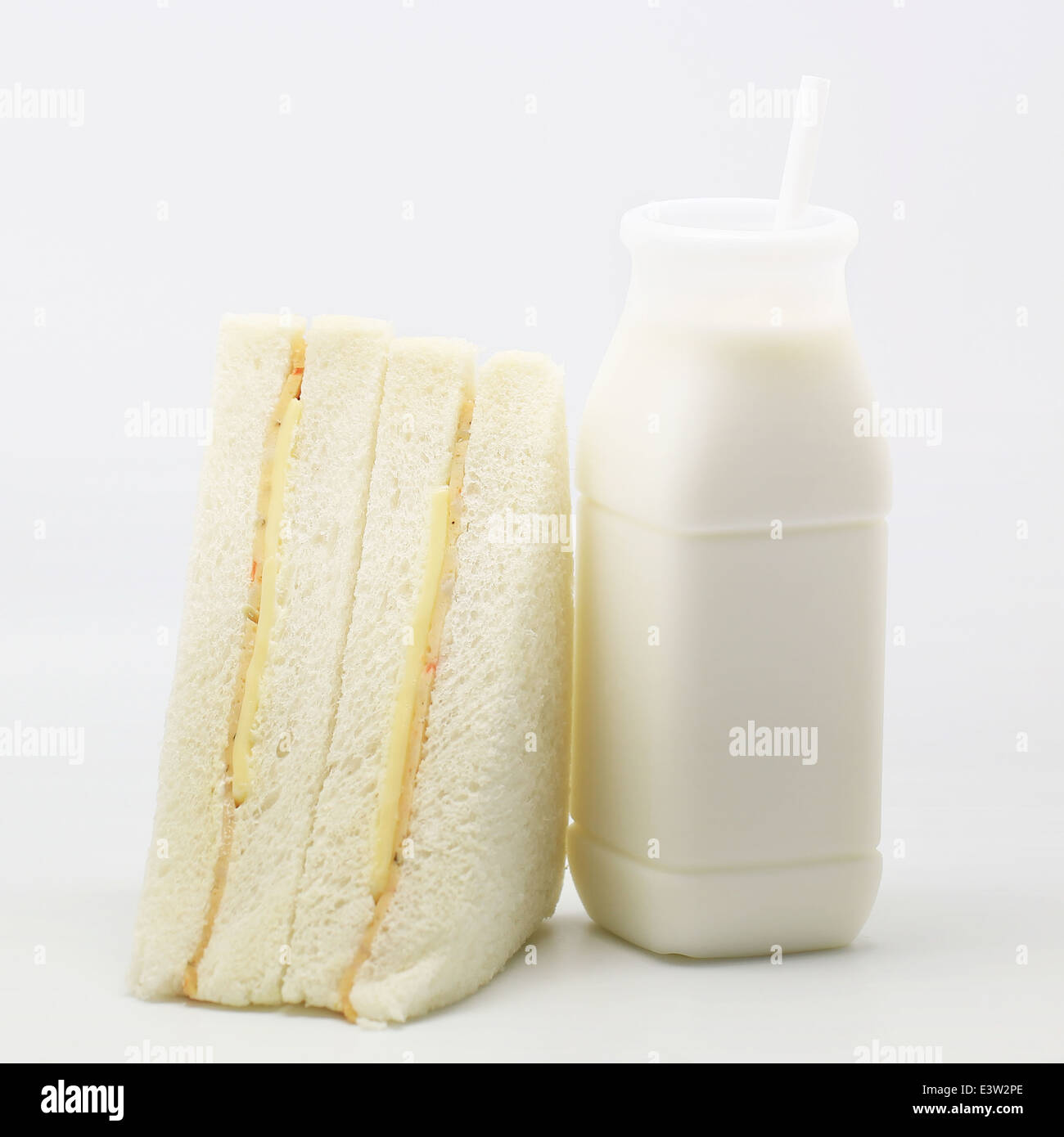 sandwich and milk on isolated background Stock Photo Alamy