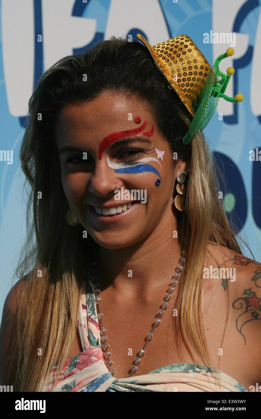 Rio de Janeiro, Brazil. 29th June 2014. 2014 FIFA World Cup Brazil. A young Brazilian with a face painting in the colors of the Dutch flag, at the FIFA Fan Fest in Copacabana Beach, before the match Netherlands 2x1 Mexico in the Round of 16. Face painting is very popular among fans in the World Cup. Rio de Janeiro, Brazil, 29th June, 2014. Credit:  Maria Adelaide Silva/Alamy Live News Stock Photo