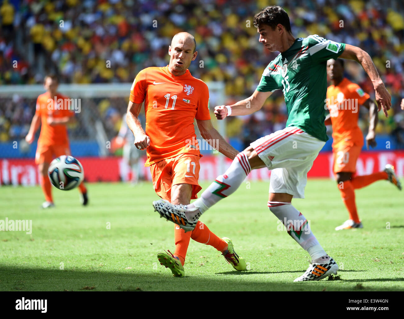 Fortaleza, Brazil. 29th June, 2014. Netherlands's Arjen Robben (L) vies with Mexico's Hector Moreno during a Round of 16 match between Netherlands and Mexico of 2014 FIFA World Cup at the Estadio Castelao Stadium in Fortaleza, Brazil, on June 29, 2014. Credit:  Li Ga/Xinhua/Alamy Live News Stock Photo