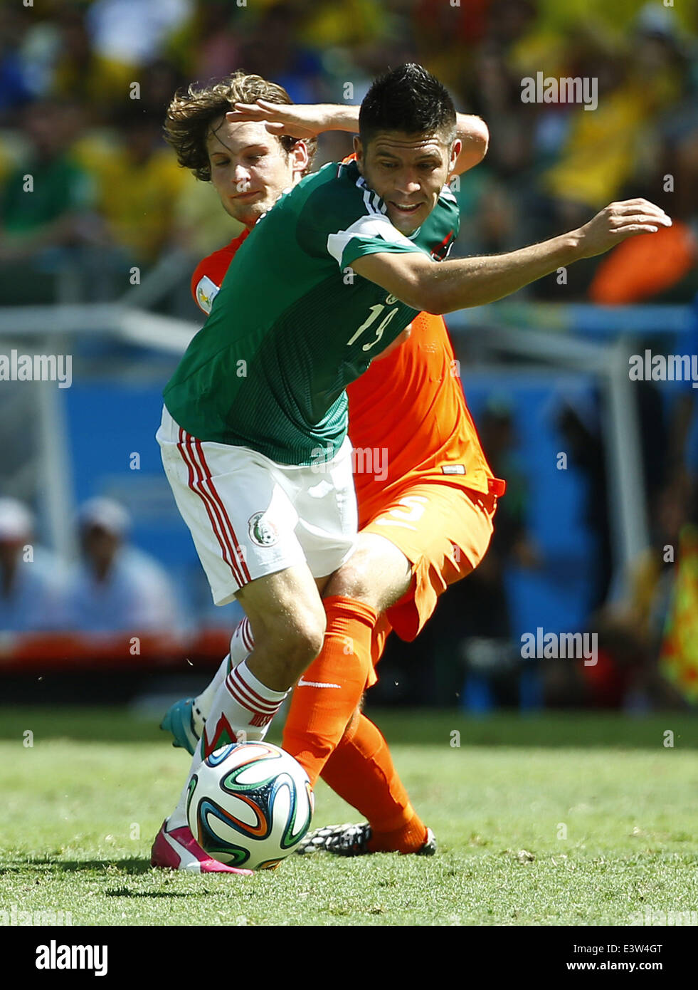Fortaleza, Brazil. 29th June, 2014. Mexico's Oribe Peralta (front) competes during a Round of 16 match between Netherlands and Mexico of 2014 FIFA World Cup at the Estadio Castelao Stadium in Fortaleza, Brazil, on June 29, 2014. Credit:  Chen Jianli/Xinhua/Alamy Live News Stock Photo