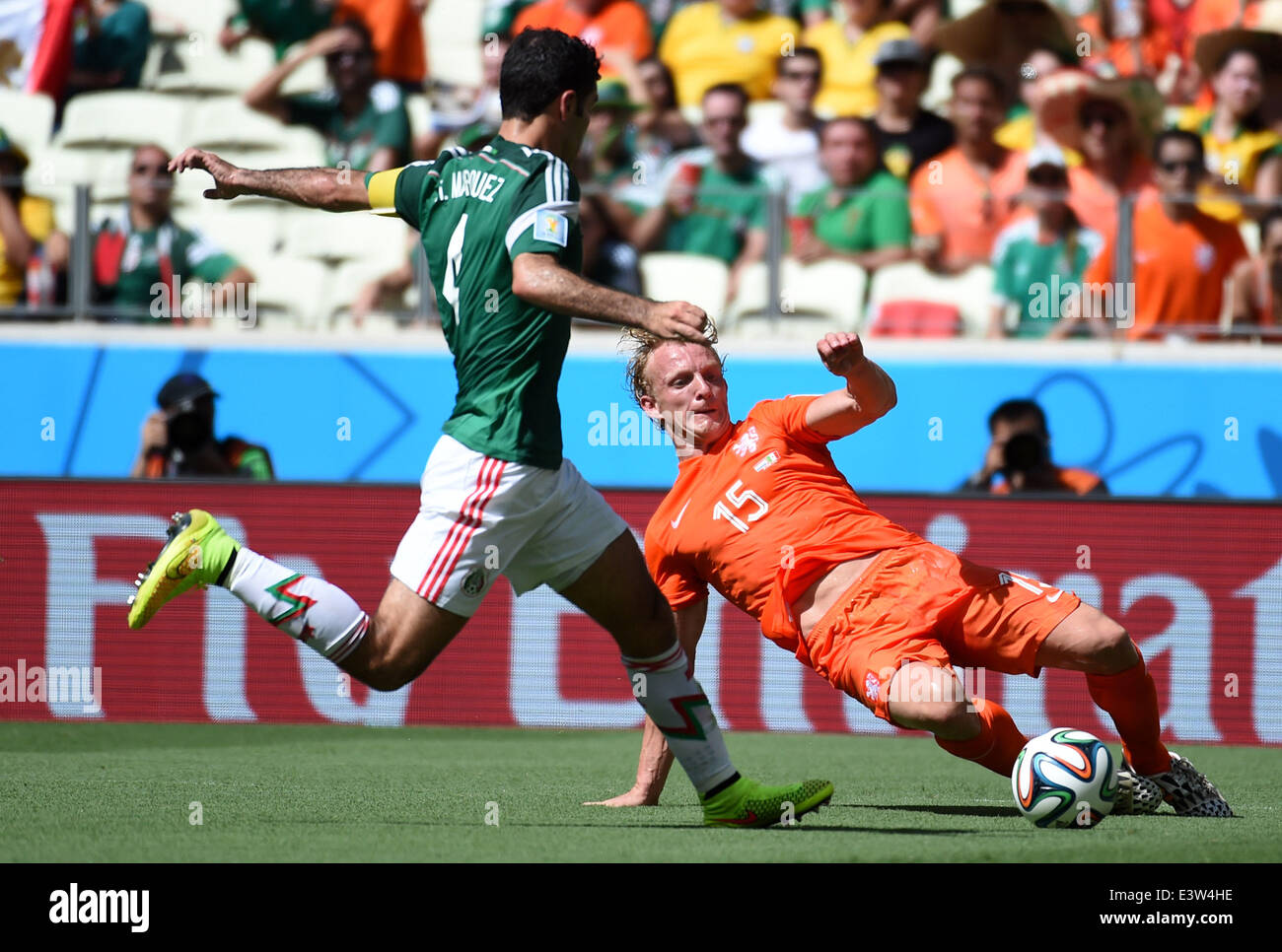 Fortaleza, Brazil. 29th June, 2014. Netherlands's Dirk Kuyt (R) vies with Mexico's Rafael Marquez during a Round of 16 match between Netherlands and Mexico of 2014 FIFA World Cup at the Estadio Castelao Stadium in Fortaleza, Brazil, on June 29, 2014. Credit:  Li Ga/Xinhua/Alamy Live News Stock Photo