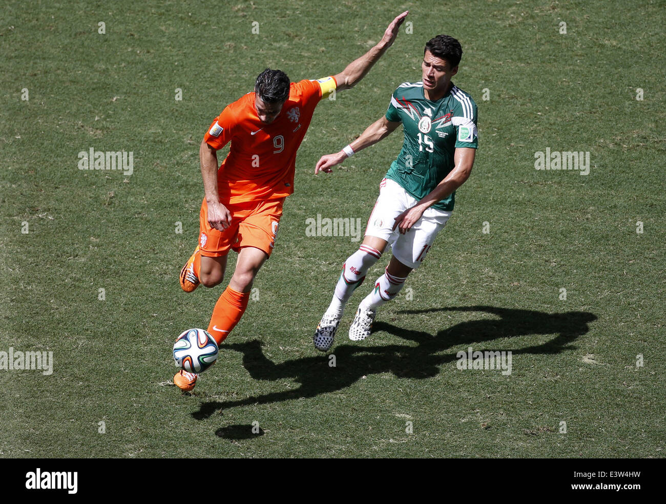 Fortaleza, Brazil. 29th June, 2014. Netherlands' Robin van Persie vies with Mexico's Hector Moreno during a Round of 16 match between Netherlands and Mexico of 2014 FIFA World Cup at the Estadio Castelao Stadium in Fortaleza, Brazil, on June 29, 2014. Credit:  Liao Yujie/Xinhua/Alamy Live News Stock Photo
