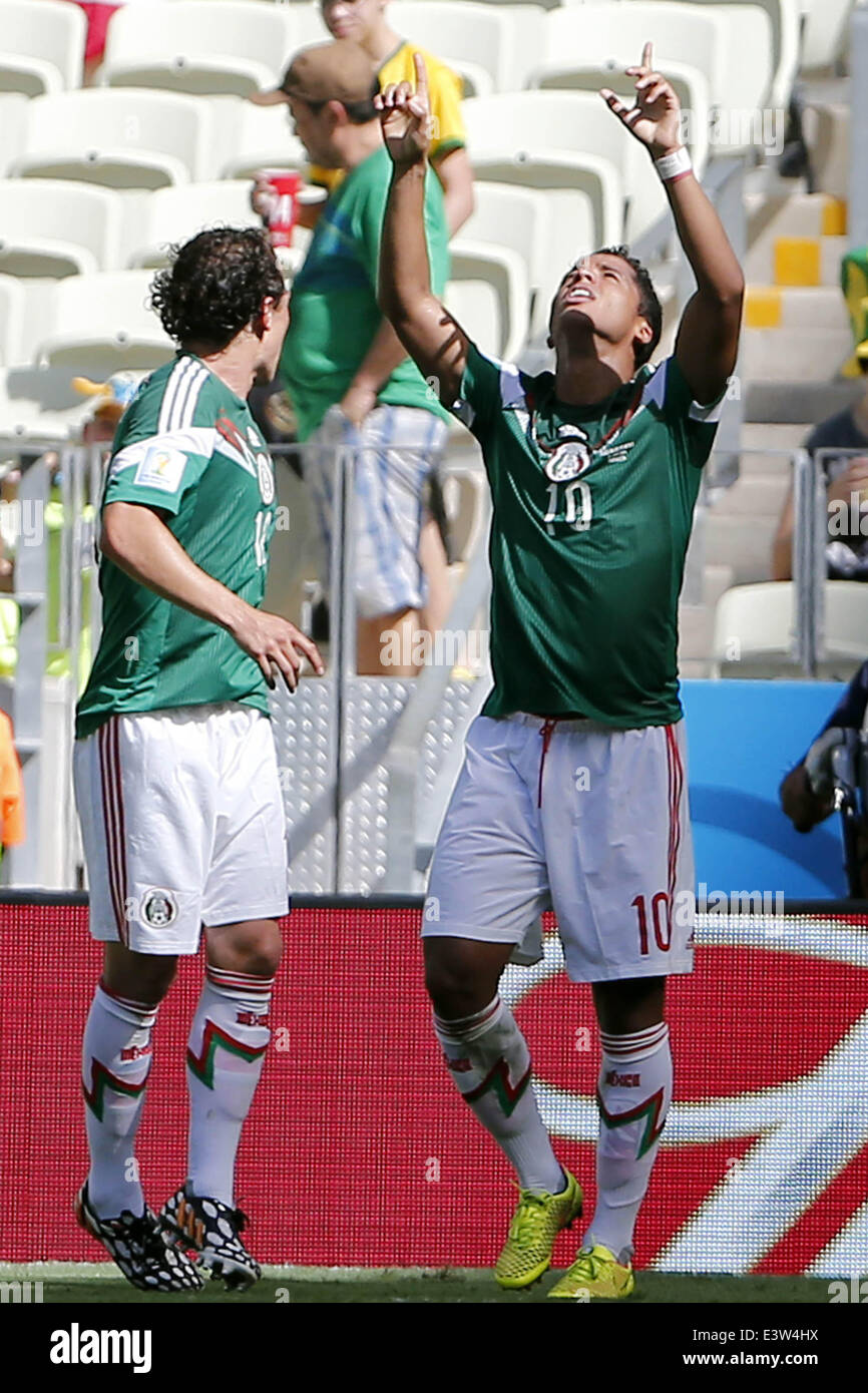 Fortaleza, Brazil. 29th June, 2014. Mexico's Giovani dos Santos (R) celebrates the goal during a Round of 16 match between Netherlands and Mexico of 2014 FIFA World Cup at the Estadio Castelao Stadium in Fortaleza, Brazil, on June 29, 2014. Credit:  Zhou Lei/Xinhua/Alamy Live News Stock Photo