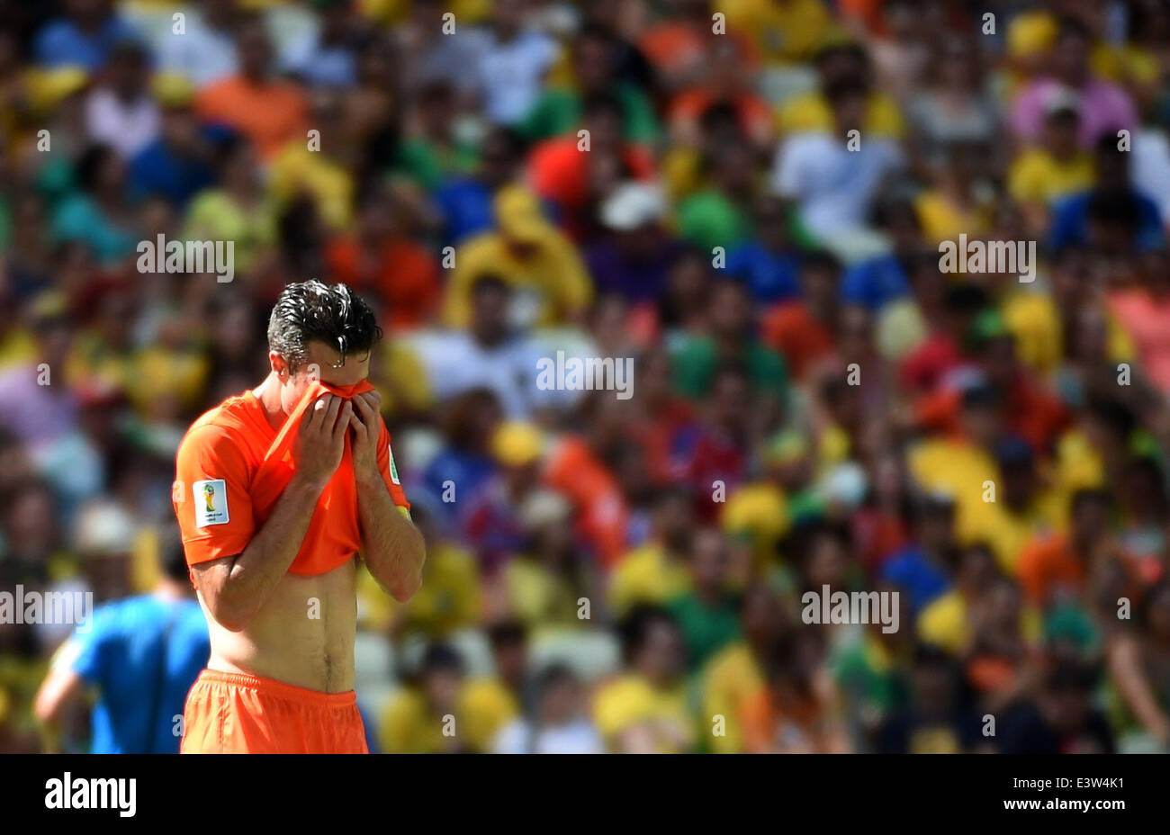 Fortaleza, Brazil. 29th June, 2014. Netherlands's Robin van Persie covers his face during a Round of 16 match between Netherlands and Mexico of 2014 FIFA World Cup at the Estadio Castelao Stadium in Fortaleza, Brazil, on June 29, 2014. Credit:  Li Ga/Xinhua/Alamy Live News Stock Photo