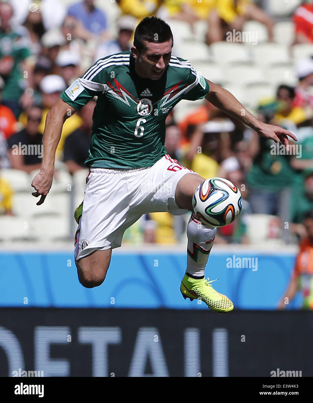 Fortaleza, Brazil. 29th June, 2014. Mexico's Hector Herrera vies for the ball during a Round of 16 match between Netherlands and Mexico of 2014 FIFA World Cup at the Estadio Castelao Stadium in Fortaleza, Brazil, on June 29, 2014. Credit:  Zhou Lei/Xinhua/Alamy Live News Stock Photo