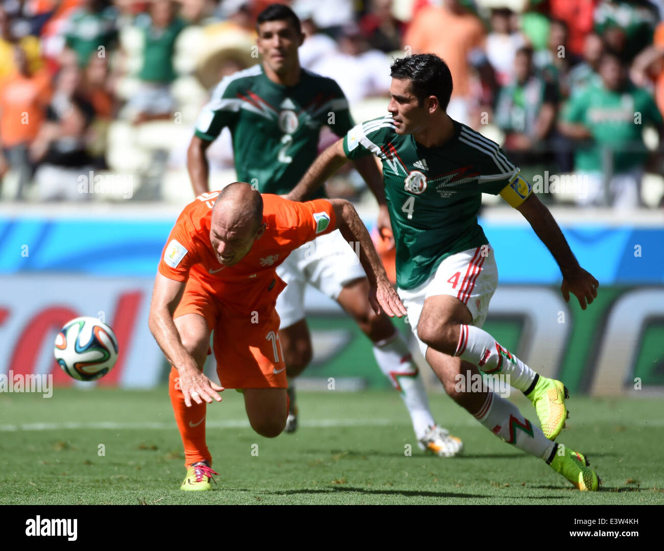 Fortaleza, Brazil. 29th June, 2014. Netherlands's Arjen Robben (L) vies with Mexico's Rafael Marquez during a Round of 16 match between Netherlands and Mexico of 2014 FIFA World Cup at the Estadio Castelao Stadium in Fortaleza, Brazil, on June 29, 2014. Credit:  Li Ga/Xinhua/Alamy Live News Stock Photo