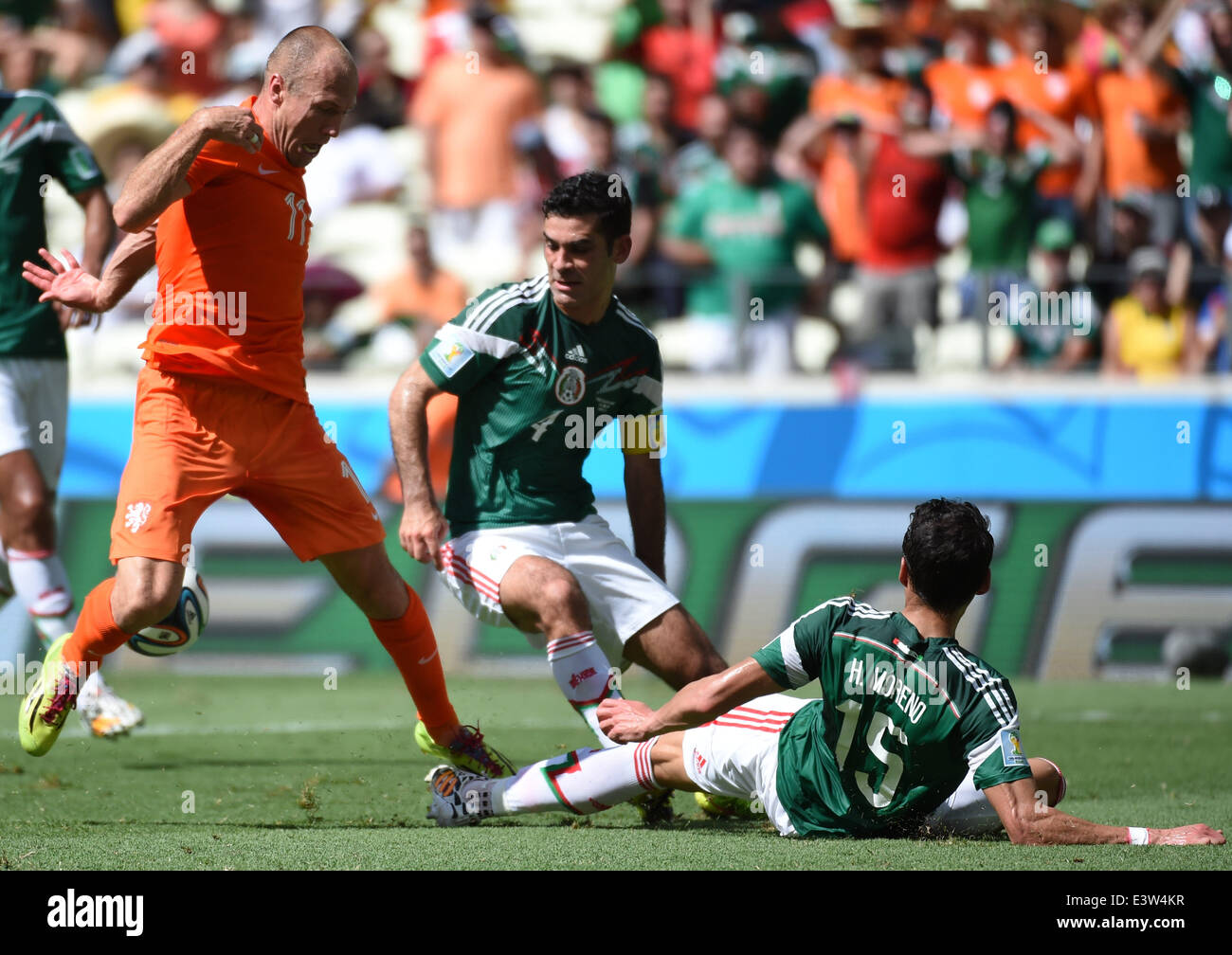 (140629) -- FORTALEZA, June 29, 2014 (Xinhua) -- Netherlands's Arjen Robben (L) vies with Mexico's Rafael Marquez (C) and Hector Moreno during a Round of 16 match between Netherlands and Mexico of 2014 FIFA World Cup at the Estadio Castelao Stadium in Fortaleza, Brazil, on June 29, 2014.(Xinhua/Li Ga)(xzj) Stock Photo
