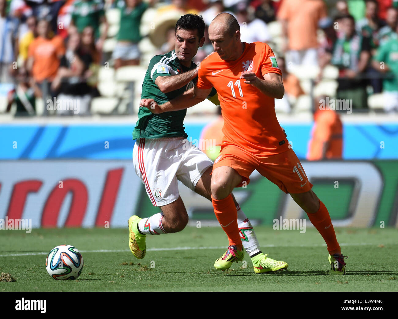 (140629) -- FORTALEZA, June 29, 2014 (Xinhua) -- Netherlands's Arjen Robben (R) competes with Rafael Marquez during a Round of 16 match between Netherlands and Mexico of 2014 FIFA World Cup at the Estadio Castelao Stadium in Fortaleza, Brazil, on June 29, 2014.(Xinhua/Li Ga)(xzj) Stock Photo