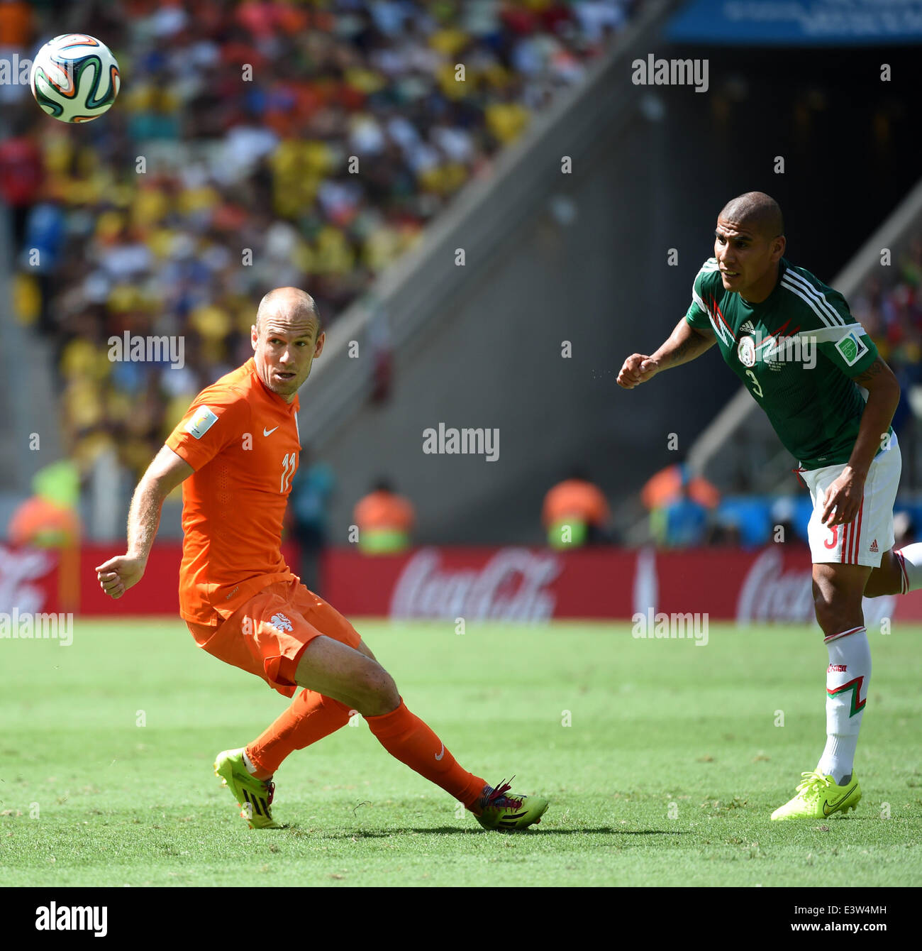 Fortaleza, Brazil. 29th June, 2014. Netherlands's Arjen Robben (L) vies with Mexico's Carlos Salcido during a Round of 16 match between Netherlands and Mexico of 2014 FIFA World Cup at the Estadio Castelao Stadium in Fortaleza, Brazil, on June 29, 2014. Netherlands won 2-1 over Mexico and qualified for Quarter-finals on Sunday. Credit:  Li Ga/Xinhua/Alamy Live News Stock Photo