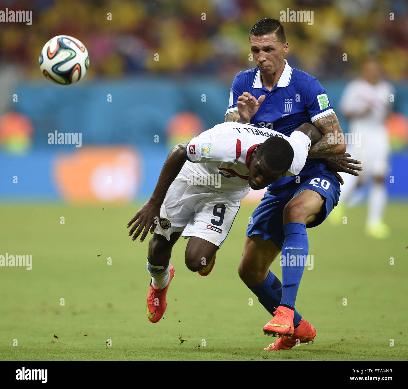 (140629) -- RECIFE, June 29, 2014 (Xinhua) -- Costa Rica's Joel Campbell (L) vies with Greece's Jose Cholevas during a Round of 16 match between Costa Rica and Greece of 2014 FIFA World Cup at the Arena Pernambuco Stadium in Recife, Brazil, on June 29, 2014.(Xinhua/Yang Lei)(xzj) Stock Photo