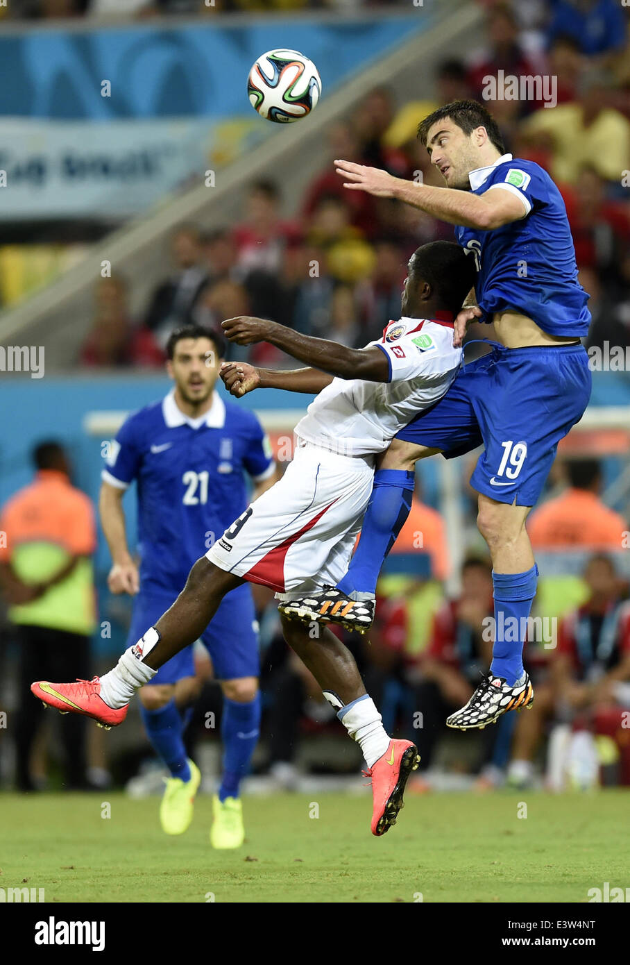 (140629) -- RECIFE, June 29, 2014 (Xinhua) -- Greece's Sokratis Papastathopoulos (R) competes for a header with Costa Rica's Joel Campbell during a Round of 16 match between Costa Rica and Greece of 2014 FIFA World Cup at the Arena Pernambuco Stadium in Recife, Brazil, on June 29, 2014.(Xinhua/Yang Lei)(xzj) Stock Photo