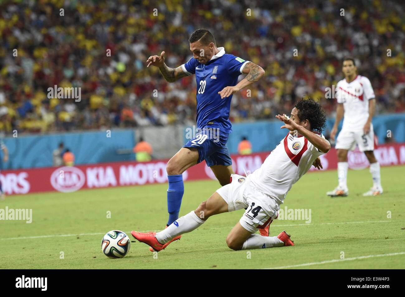 (140629) -- RECIFE, June 29, 2014 (Xinhua) -- Costa Rica's Randall Brenes (R) vies with Greece's Jose Cholevas during a Round of 16 match between Costa Rica and Greece of 2014 FIFA World Cup at the Arena Pernambuco Stadium in Recife, Brazil, on June 29, 2014.(Xinhua/Lui Siu Wai)(pcy) Stock Photo