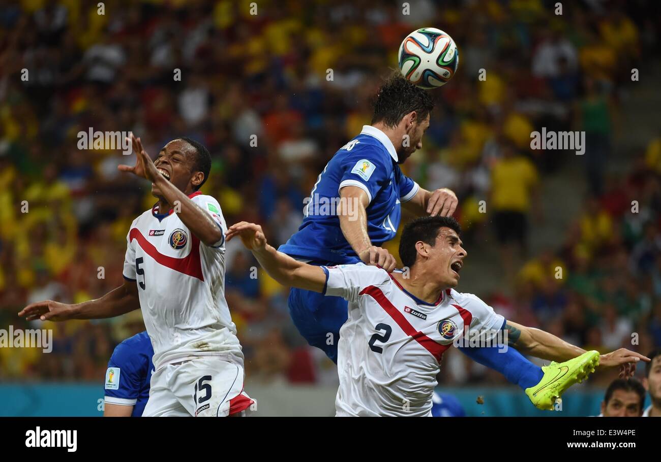 (140629) -- RECIFE, June 29, 2014 (Xinhua) -- Greece's Kostas Katsouranis (C) jumps for the ball during a Round of 16 match between Costa Rica and Greece of 2014 FIFA World Cup at the Arena Pernambuco Stadium in Recife, Brazil, on June 29, 2014.(Xinhua/Guo Yong)(rh) Stock Photo