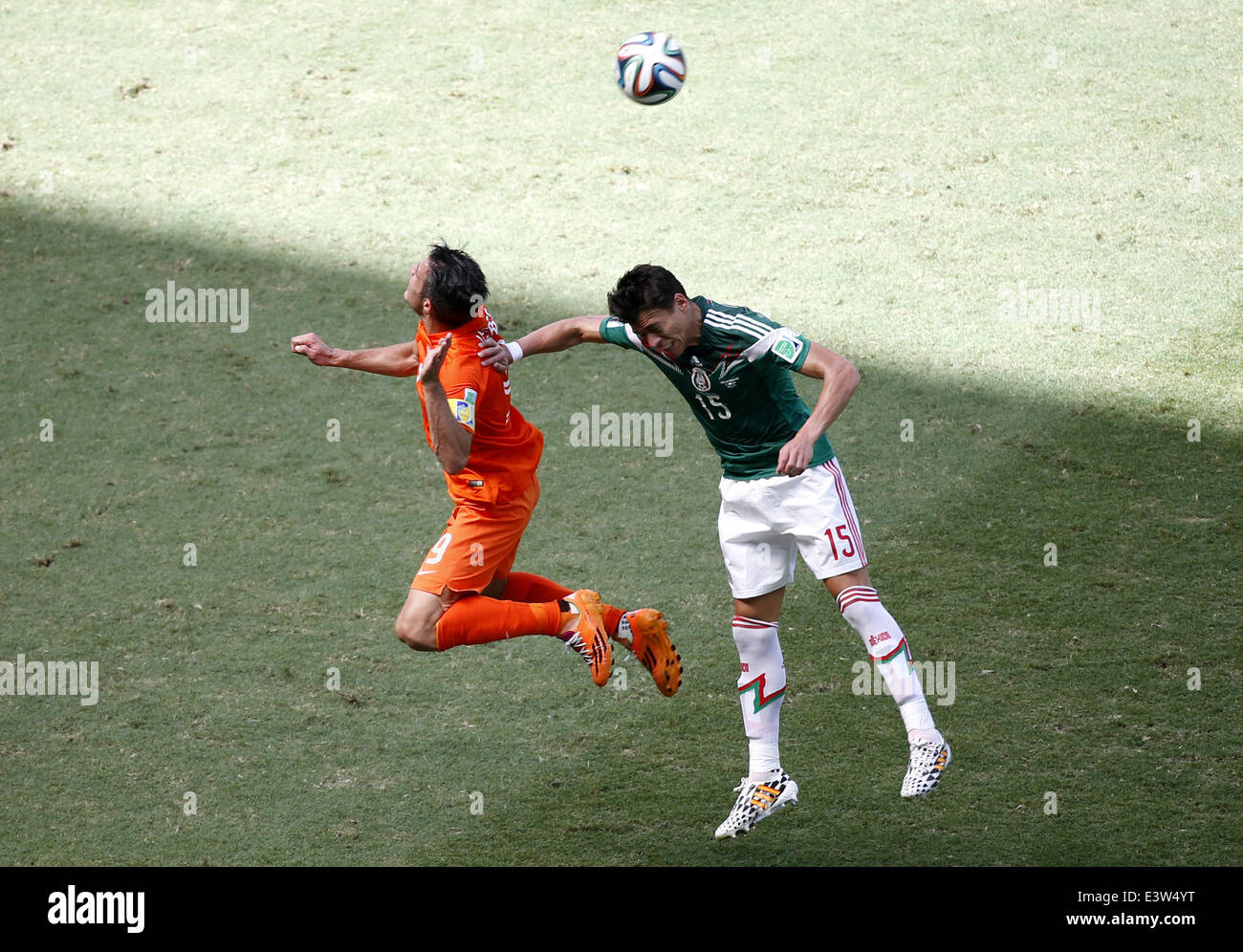 Fortaleza, Brazil. 29th June, 2014. Mexico's Hector Moreno (R) vies with Netherlands' Robin van Persie during a Round of 16 match between Netherlands and Mexico of 2014 FIFA World Cup at the Estadio Castelao Stadium in Fortaleza, Brazil, on June 29, 2014. Credit:  Liao Yujie/Xinhua/Alamy Live News Stock Photo