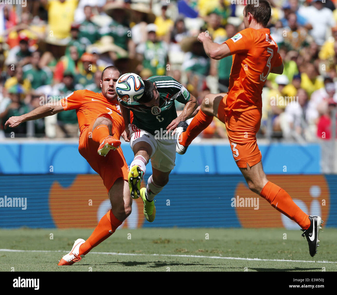 Fortaleza, Brazil. 29th June, 2014. Mexico's Hector Herrera (C) vies for the ball during a Round of 16 match between Netherlands and Mexico of 2014 FIFA World Cup at the Estadio Castelao Stadium in Fortaleza, Brazil, on June 29, 2014. Credit:  Zhou Lei/Xinhua/Alamy Live News Stock Photo
