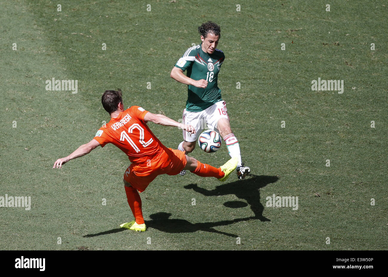 Fortaleza, Brazil. 29th June, 2014. Mexico's Andres Guardado (R) vies with Netherlands' Paul Verhaegh during a Round of 16 match between Netherlands and Mexico of 2014 FIFA World Cup at the Estadio Castelao Stadium in Fortaleza, Brazil, on June 29, 2014. Credit:  Liao Yujie/Xinhua/Alamy Live News Stock Photo