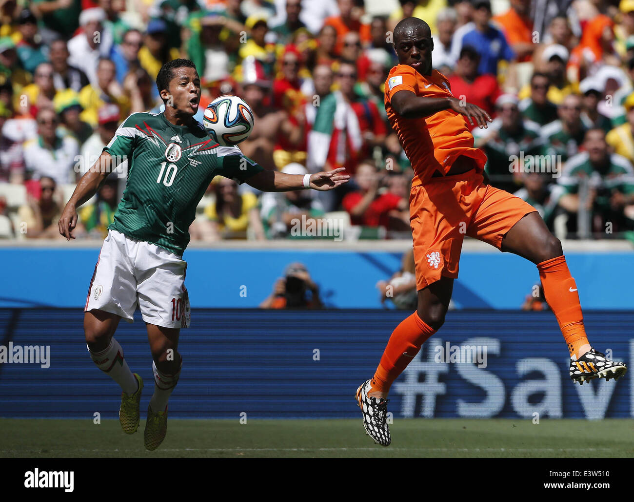 Fortaleza, Brazil. 29th June, 2014. Mexico's Giovani dos Santos stops the ball during a Round of 16 match between Netherlands and Mexico of 2014 FIFA World Cup at the Estadio Castelao Stadium in Fortaleza, Brazil, on June 29, 2014. Credit:  Zhou Lei/Xinhua/Alamy Live News Stock Photo