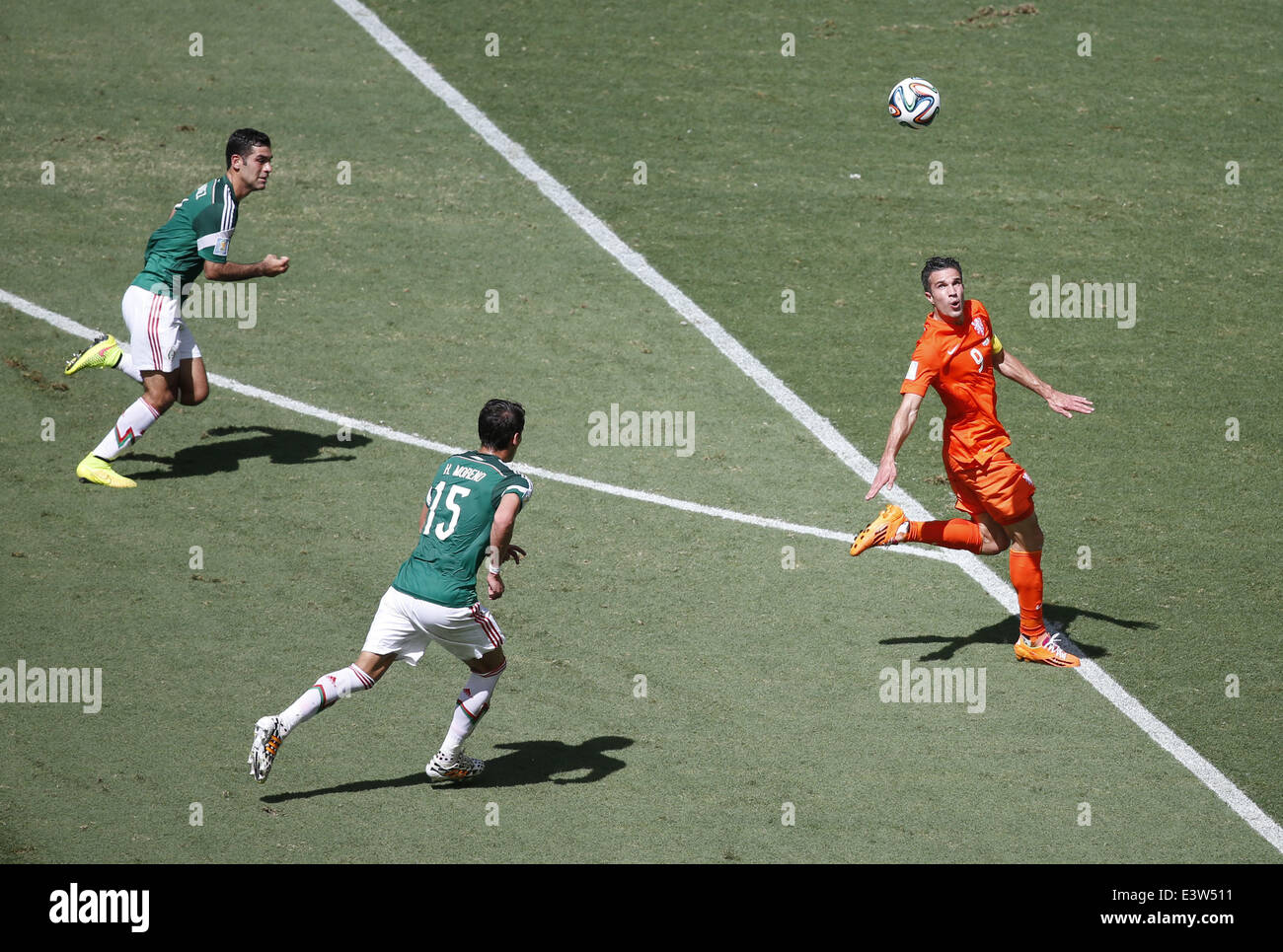 Fortaleza, Brazil. 29th June, 2014. Netherlands' Robin van Persie (R) vies for the ball during a Round of 16 match between Netherlands and Mexico of 2014 FIFA World Cup at the Estadio Castelao Stadium in Fortaleza, Brazil, on June 29, 2014. Credit:  Liao Yujie/Xinhua/Alamy Live News Stock Photo