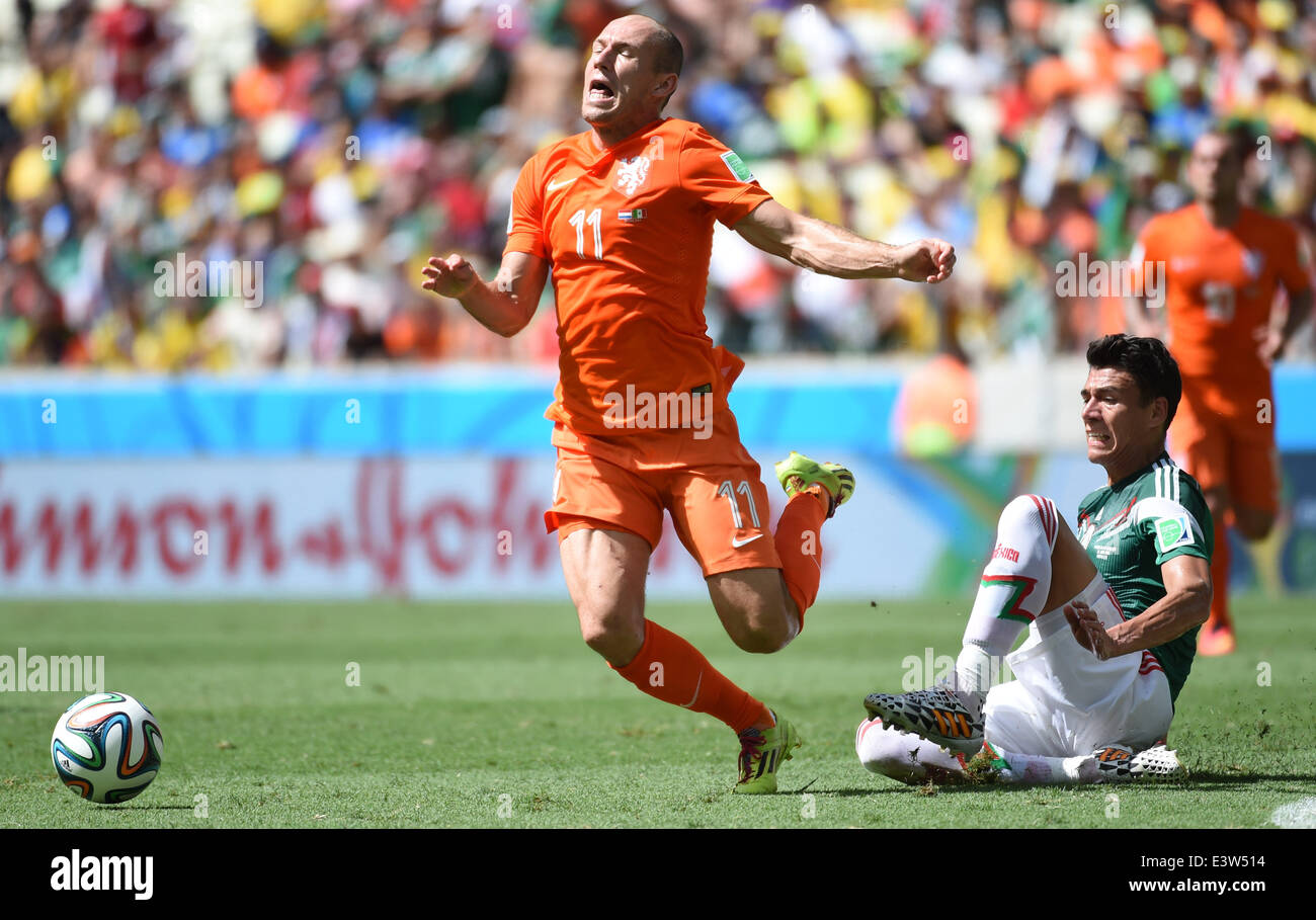 Fortaleza, Brazil. 29th June, 2014. Netherlands's Arjen Robben (L) is tripped by Mexcico's Hector Moreno during a Round of 16 match between Netherlands and Mexico of 2014 FIFA World Cup at the Estadio Castelao Stadium in Fortaleza, Brazil, on June 29, 2014. Credit:  Li Ga/Xinhua/Alamy Live News Stock Photo