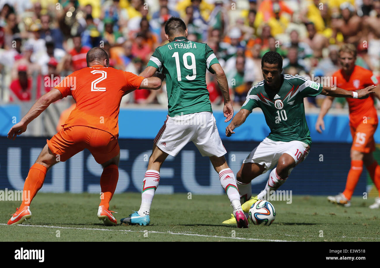 Fortaleza, Brazil. 29th June, 2014. Mexico's Giovani dos Santos (R) controls the ball during a Round of 16 match between Netherlands and Mexico of 2014 FIFA World Cup at the Estadio Castelao Stadium in Fortaleza, Brazil, on June 29, 2014. Credit:  Zhou Lei/Xinhua/Alamy Live News Stock Photo