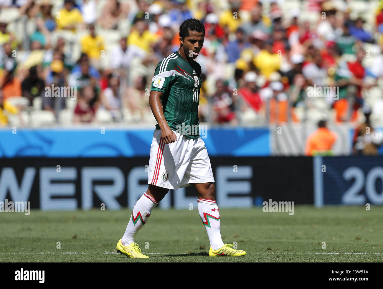 Fortaleza, Brazil. 29th June, 2014. Mexico's Giovani dos Santos reacts during a Round of 16 match between Netherlands and Mexico of 2014 FIFA World Cup at the Estadio Castelao Stadium in Fortaleza, Brazil, on June 29, 2014. Credit:  Zhou Lei/Xinhua/Alamy Live News Stock Photo