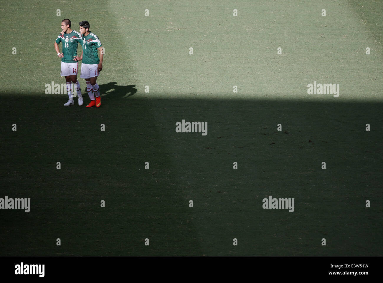 Fortaleza, Brazil. 29th June, 2014. Mexico's Javier Hernandez (L) and Alan Pulido react after a Round of 16 match between Netherlands and Mexico of 2014 FIFA World Cup at the Estadio Castelao Stadium in Fortaleza, Brazil, on June 29, 2014. Netherlands won 2-1 over Mexico and qualified for Quarter-finals on Sunday. Credit:  Liao Yujie/Xinhua/Alamy Live News Stock Photo