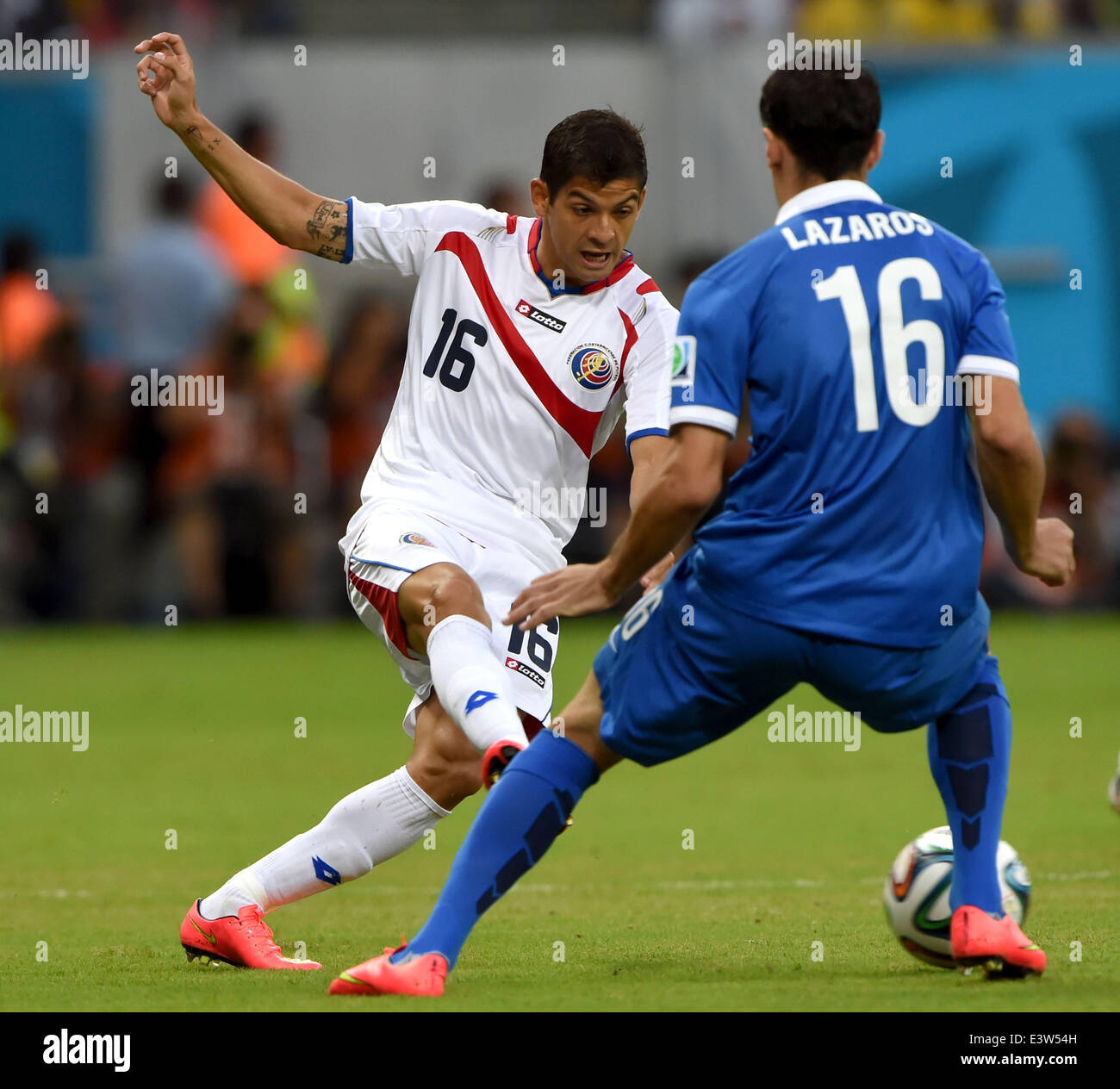 (140629) -- RECIFE, June 29, 2014 (Xinhua) -- Costa Rica's Christian Gamboa vies with Greece's Lazaros Christodoulopoulos during a Round of 16 match between Costa Rica and Greece of 2014 FIFA World Cup at the Arena Pernambuco Stadium in Recife, Brazil, on June 29, 2014.(Xinhua/Guo Yong)(rh) Stock Photo