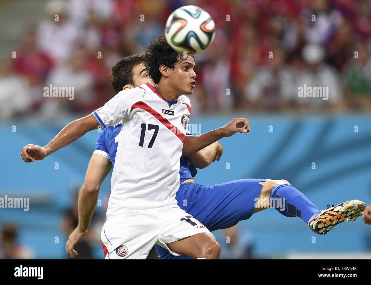 (140629) -- RECIFE, June 29, 2014 (Xinhua) -- Costa Rica's Yeltsin Tejeda (front) competes for a header during a Round of 16 match between Costa Rica and Greece of 2014 FIFA World Cup at the Arena Pernambuco Stadium in Recife, Brazil, on June 29, 2014.(Xinhua/Yang Lei)(xzj) Stock Photo