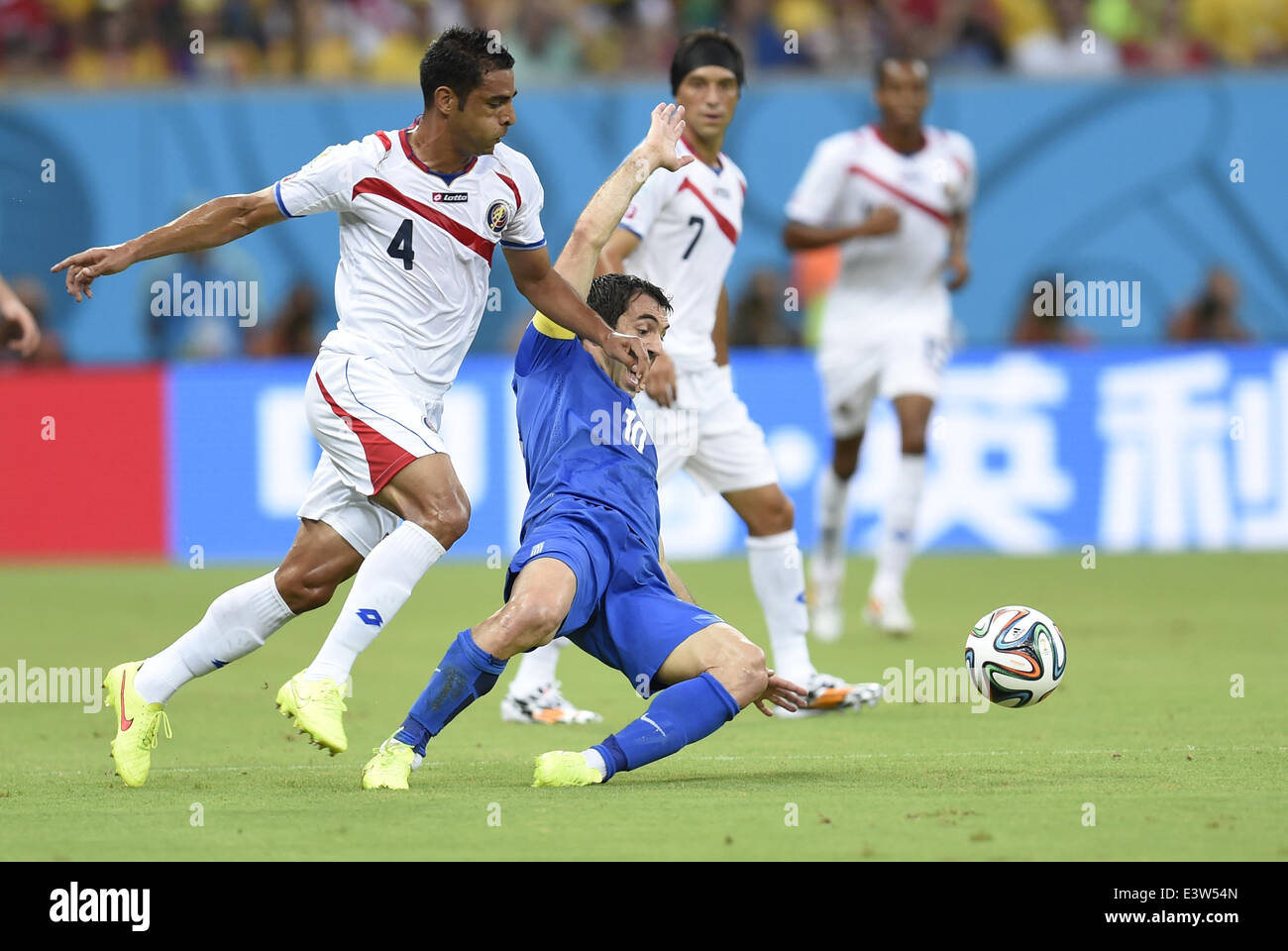(140629) -- RECIFE, June 29, 2014 (Xinhua) -- Costa Rica's Michael Umana (L, front) vies with Greece's Giorgos Karagounis (R, front) during a Round of 16 match between Costa Rica and Greece of 2014 FIFA World Cup at the Arena Pernambuco Stadium in Recife, Brazil, on June 29, 2014.(Xinhua/Yang Lei)(xzj) Stock Photo